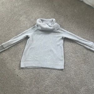 Turtle necked grey sweater with thumb holes.